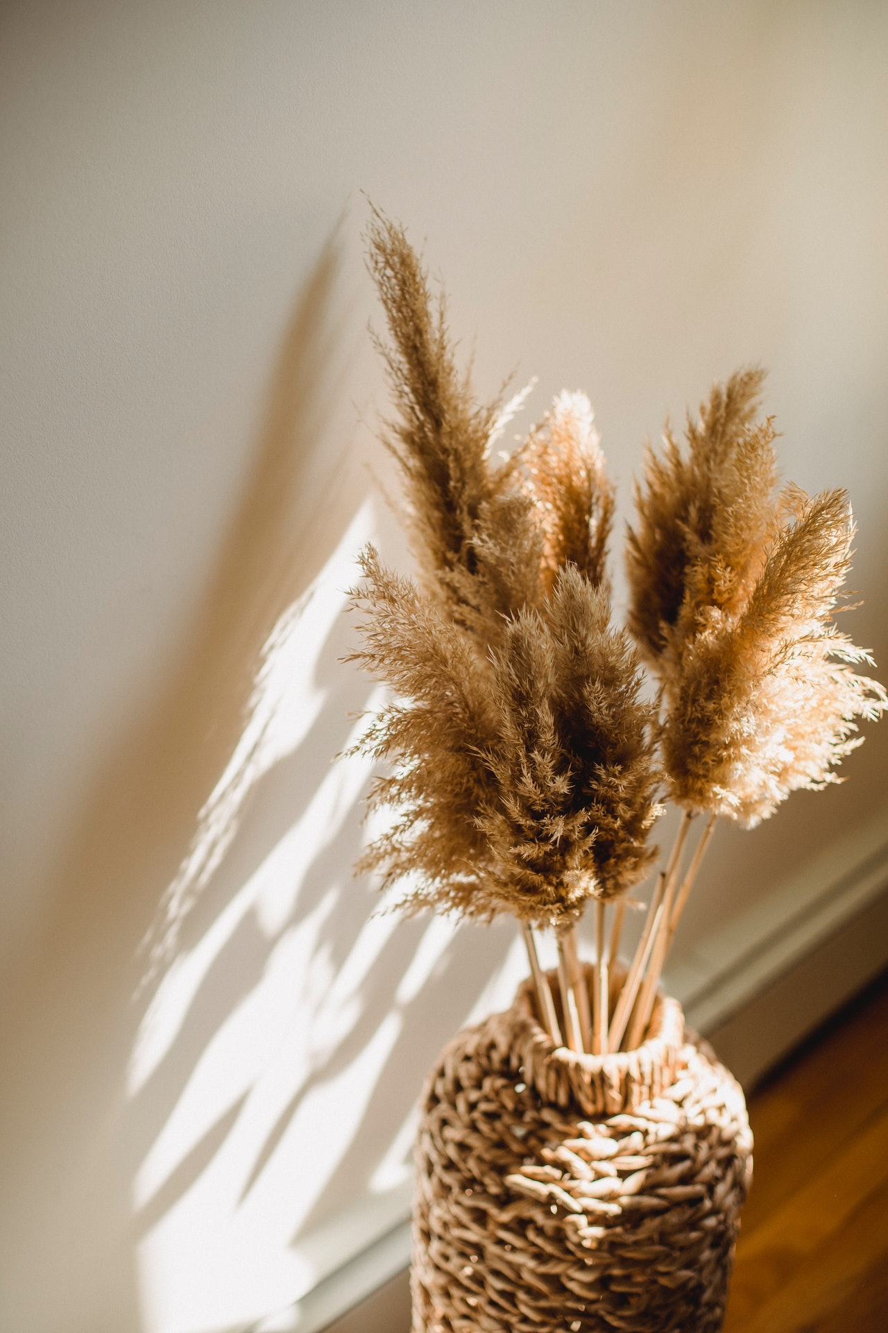 dried grasses in woven vase