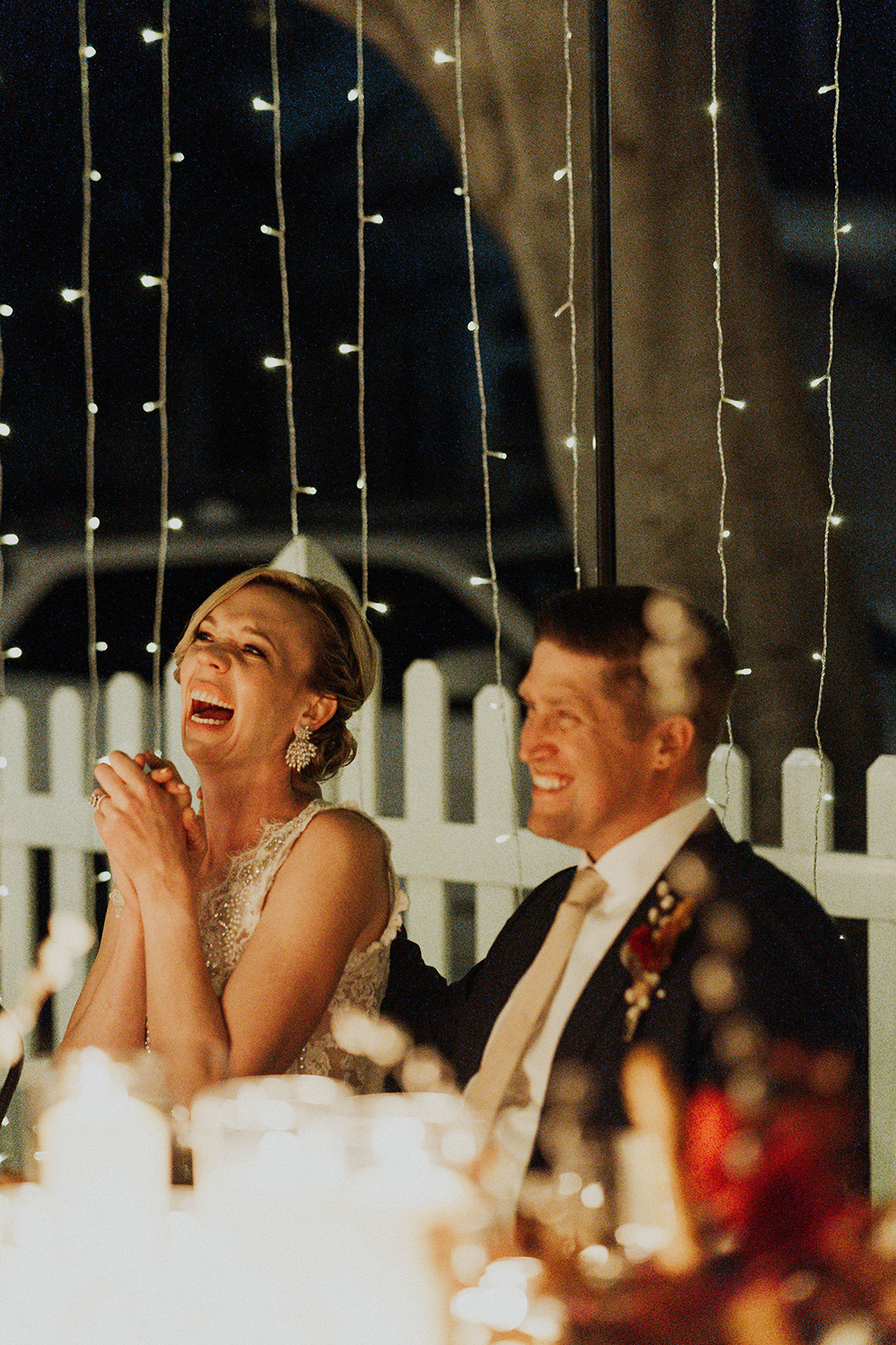 bride and groom laughing wedding reception